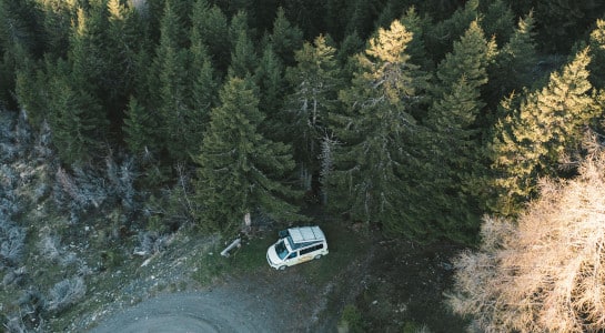 campervan in a forest, drone photo