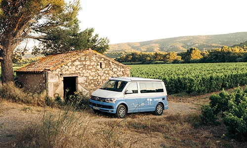 roadsurfer van parking at a farm