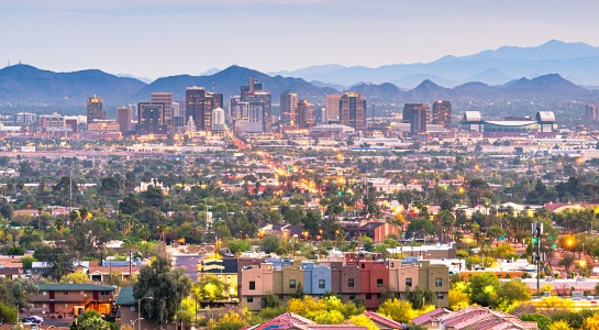 Skyline of Phoenix with the mountains visible in the background.