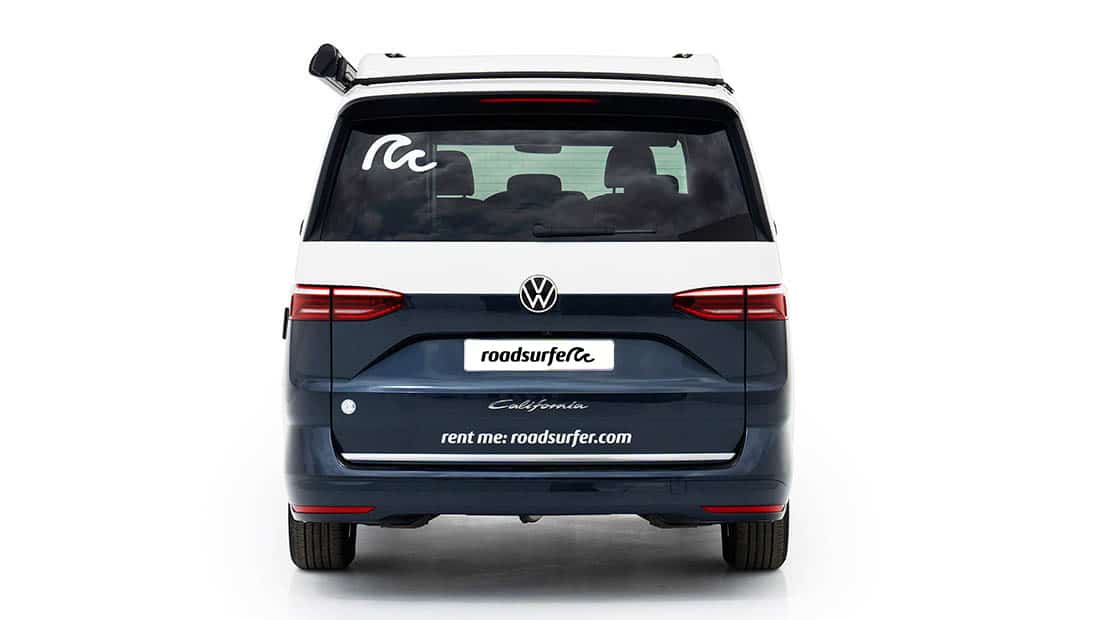 new vw california ocean as roadsurfer campervan sunrise suite in dark blue from the back